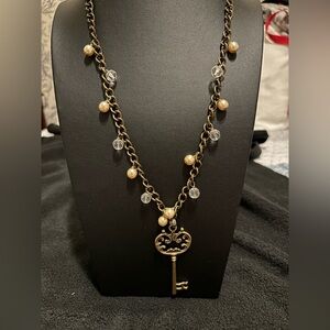 Elegant Key Pendant Necklace with Gold and Silver Accents